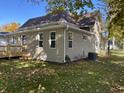 Tan house with new siding and deck at 402 S Broadway St, Pendleton, IN 46064