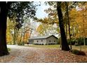 Detached garage with fall foliage backdrop at 9230 Nw Oak St, Alexandria, IN 46001