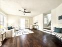 Spacious living room with hardwood floors and large windows at 2641 Guilford Ave, Indianapolis, IN 46205