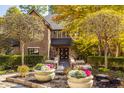 Brick house exterior with landscaping and large planters at 9468 Sullivan Pl, Zionsville, IN 46077