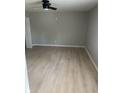 Large bedroom with light grey walls and wood-look flooring at 1618 N Rural St, Indianapolis, IN 46218