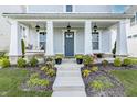 Front porch with swing and landscaping at 1939 Ponsonby Dr, Westfield, IN 46074