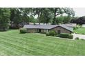Aerial view of a ranch home, showcasing the house and surrounding neighborhood at 2212 Larita Ln, Anderson, IN 46017