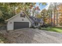 Gray house with gray shutters, a two-car garage and a gravel driveway at 6971 Lynx Dr, Nineveh, IN 46164