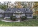 Two-story home with gray siding, gray shutters, and a landscaped yard at 6971 Lynx Dr, Nineveh, IN 46164