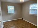 Spacious bedroom with neutral walls and wood-look flooring at 6150 Oak Ave, Indianapolis, IN 46219
