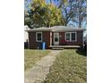 Brick ranch home with a front porch and well-maintained lawn at 4529 Crittenden Ave, Indianapolis, IN 46205