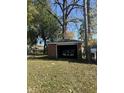 Detached brick garage with a large door and ample space at 4529 Crittenden Ave, Indianapolis, IN 46205