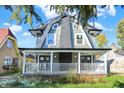 Attractive two-story home with gray siding and a charming front porch at 3616 N College Ave, Indianapolis, IN 46205