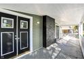 Inviting front porch with double doors and brick accents at 3616 N College Ave, Indianapolis, IN 46205