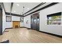 Spacious living room with hardwood floors, fireplace, and high ceilings at 3752 Ruckle St, Indianapolis, IN 46205