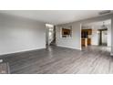 Open concept living room with kitchen view and grey flooring at 19420 Golden Meadow Way, Noblesville, IN 46060