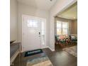 Bright entryway with hardwood floors and seating area at 236 Sam Himsel Way, Danville, IN 46122