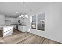 Bright eat-in kitchen with white cabinets and an island at 10549 Maidenhair Dr, Indianapolis, IN 46239