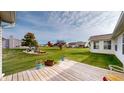 View from deck shows large backyard and neighboring homes at 1202 Creek Bend Dr, Greenwood, IN 46143