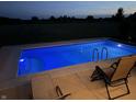 Rectangular inground pool with blue lighting at night at 3503 W 100 N, Bargersville, IN 46106