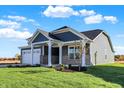 House exterior with gray siding and stone accents at 7171 Rose Hill Ave, Brownsburg, IN 46112