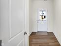 Bright entryway with wood-look floors and white doors leading to other rooms at 7171 Rose Hill Ave, Brownsburg, IN 46112