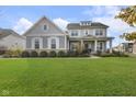 Two-story home with gray siding, white trim, and a landscaped lawn at 3577 Idlewind Dr, Westfield, IN 46074