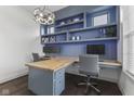 Home office with built-in shelving and a large desk at 3577 Idlewind Dr, Westfield, IN 46074