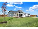 Gray siding craftsman style home with a large yard at 7144 Rose Hill Ave, Brownsburg, IN 46112