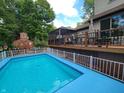 Inviting inground pool with a spacious deck and fenced-in backyard at 6605 Donnelly Dr, Brownsburg, IN 46112