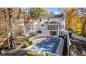 Home with inground pool and large backyard in autumn setting at 6902 Creekridge Trl, Indianapolis, IN 46256