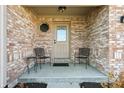 Inviting front porch with brick facade and seating at 3784 Mansfield Dr, Brownsburg, IN 46112