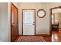 Bright entryway with hardwood floors and stained wood doors at 3784 Mansfield Dr, Brownsburg, IN 46112