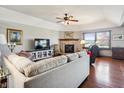 Spacious living room with hardwood floors, fireplace and large windows at 3784 Mansfield Dr, Brownsburg, IN 46112