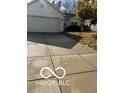 Spacious driveway with attached two-car garage at 5643 Woodland Way, Indianapolis, IN 46254