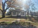Single story home with front porch and tree at 325 E Church St, Paragon, IN 46166
