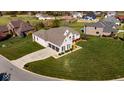 Brick house with a large backyard and circular driveway, in a beautiful neighborhood at 7610 Monte Carlo Way, Indianapolis, IN 46278