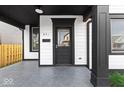Black front door with glass panel and sidelights at 631 Cottage Ave, Indianapolis, IN 46203