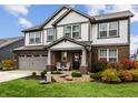 Two-story home with gray siding, brick accents, and a landscaped lawn at 3680 Drummore Pl, Bargersville, IN 46106