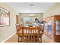 Bright dining room featuring a wood table and built-in hutch at 595 Hawthorne Dr, Carmel, IN 46033