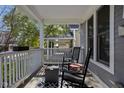 Relaxing front porch with rocking chairs and a view of the street at 2016 Central Ave, Indianapolis, IN 46202