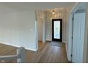 Bright entryway with hardwood floors, a stained glass door, and an open concept at 2413 Griton Ct, Shelbyville, IN 46176