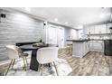 Modern kitchen with white cabinets, dark wood countertops, and black appliances at 1621 Draper St, Indianapolis, IN 46203