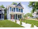 Stunning blue two-story house, nicely landscaped at 408 W 11Th St, Anderson, IN 46016