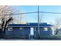 Gray house with a spacious backyard and chain link fence at 1601 Draper St, Indianapolis, IN 46203