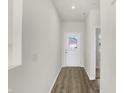 Bright entryway with light wood flooring and a white door at 7139 Rose Hill Ave, Brownsburg, IN 46112
