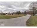 Long driveway leading to house and detached garage at 8190 Beech Grove Rd, Martinsville, IN 46151