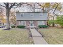 Two-story house with brick and siding, landscaping, and walkway at 4902 N Capitol Ave, Indianapolis, IN 46208