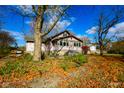 House exterior with stone walkway and autumn leaves at 3136 E Edgewood Ave, Indianapolis, IN 46227