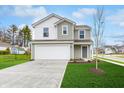 Two-story house with gray siding, white garage door, and landscaped lawn at 1124 Lona Dr, Martinsville, IN 46151