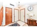 Bright entryway with tiled floor, coat closet, and wood door at 8191 Frisco Way, Indianapolis, IN 46240