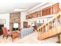 Spacious living room with a stone fireplace and high ceilings at 8191 Frisco Way, Indianapolis, IN 46240