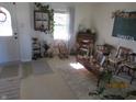 Cozy living room featuring hardwood floors, a coffee table, and comfortable seating at 940 Shenandoah Way, Greenwood, IN 46143