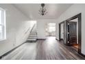 Open living room with hardwood floors and a staircase at 425 Sanders St, Indianapolis, IN 46225